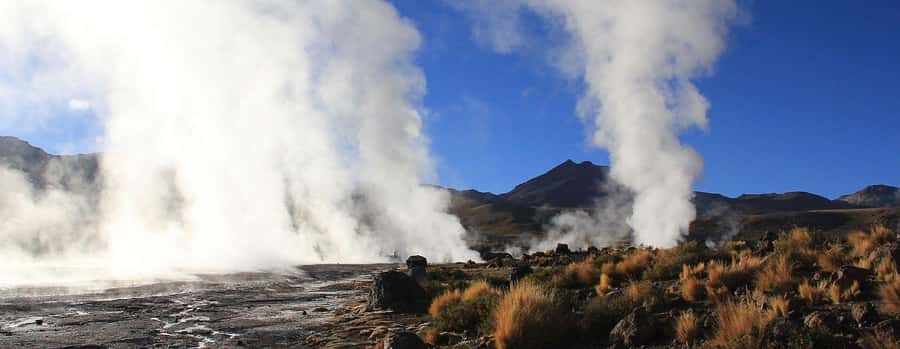 San Pedro de Atacama: El Tatio Geysers & Machuca Lagoon Trip - Walking beside thermal pools and watching steam from dozens of vents
